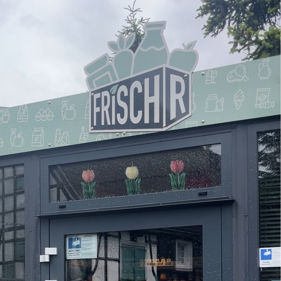 Das Schild vom Lebensmittelcontainer FrischR